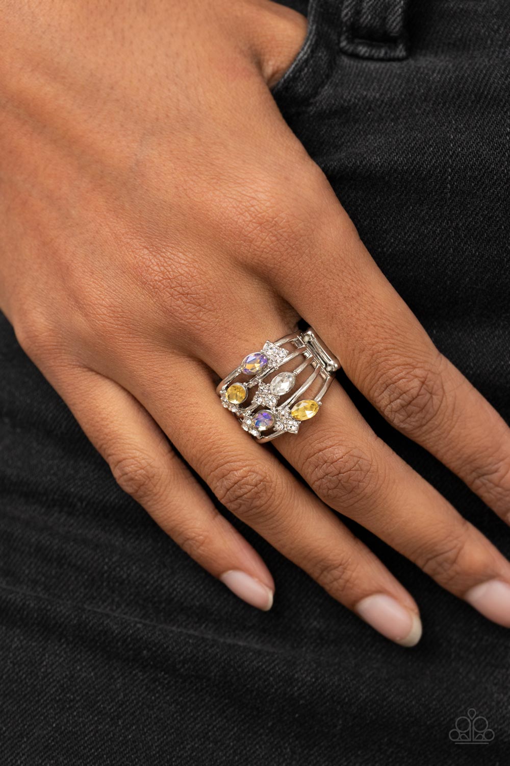 Paparazzi Accessories Ethereal Escapade - Yellow Infused with clusters of dainty white rhinestones, a glitzy collection of yellow, iridescent, and white oval rhinestones are sprinkled across layers of silver bands, creating an ethereal sparkle across the