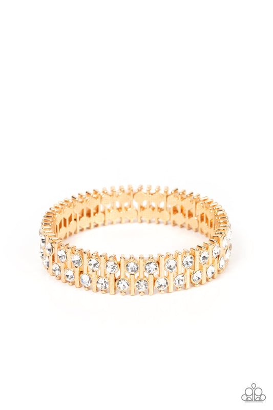 Paparazzi Accessories Generational Glimmer - Gold Attached to gold bars, a staggered display of solitaire white rhinestones alternates along a stretchy band around the wrist for an unexpected pop of shimmer around the wrist. Sold as one individual bracele