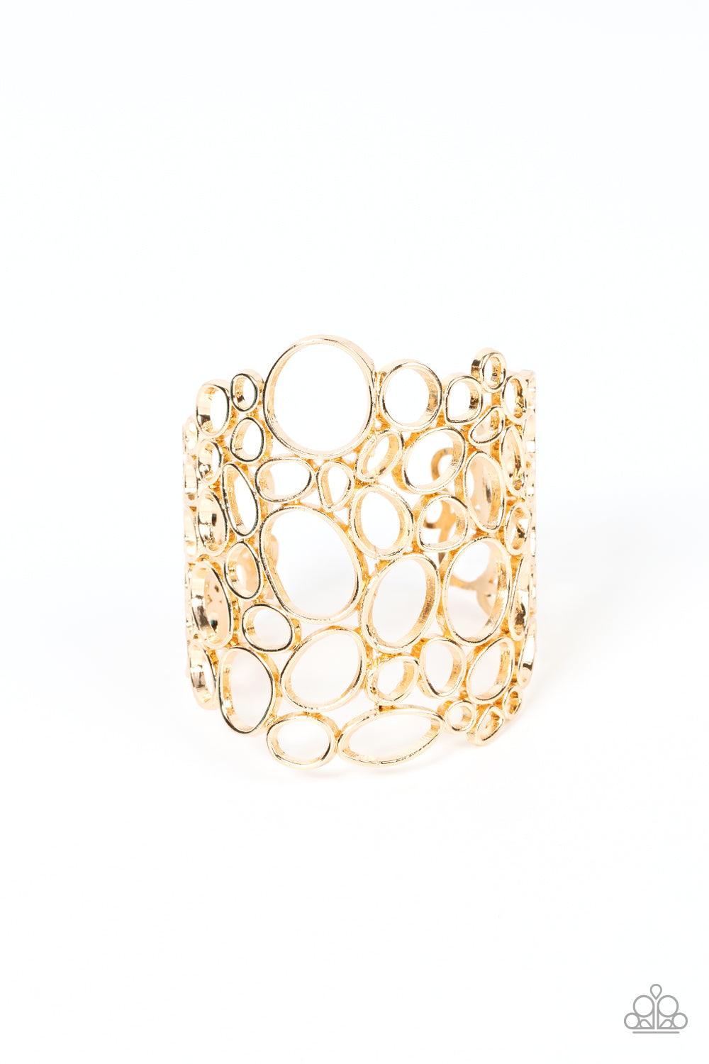 Paparazzi Accessories All Turned Around - Gold Varying in shape and size, asymmetrical gold circular frames delicately connect into an effervescently abstract cuff around the wrist. Sold as one individual bracelet. Jewelry