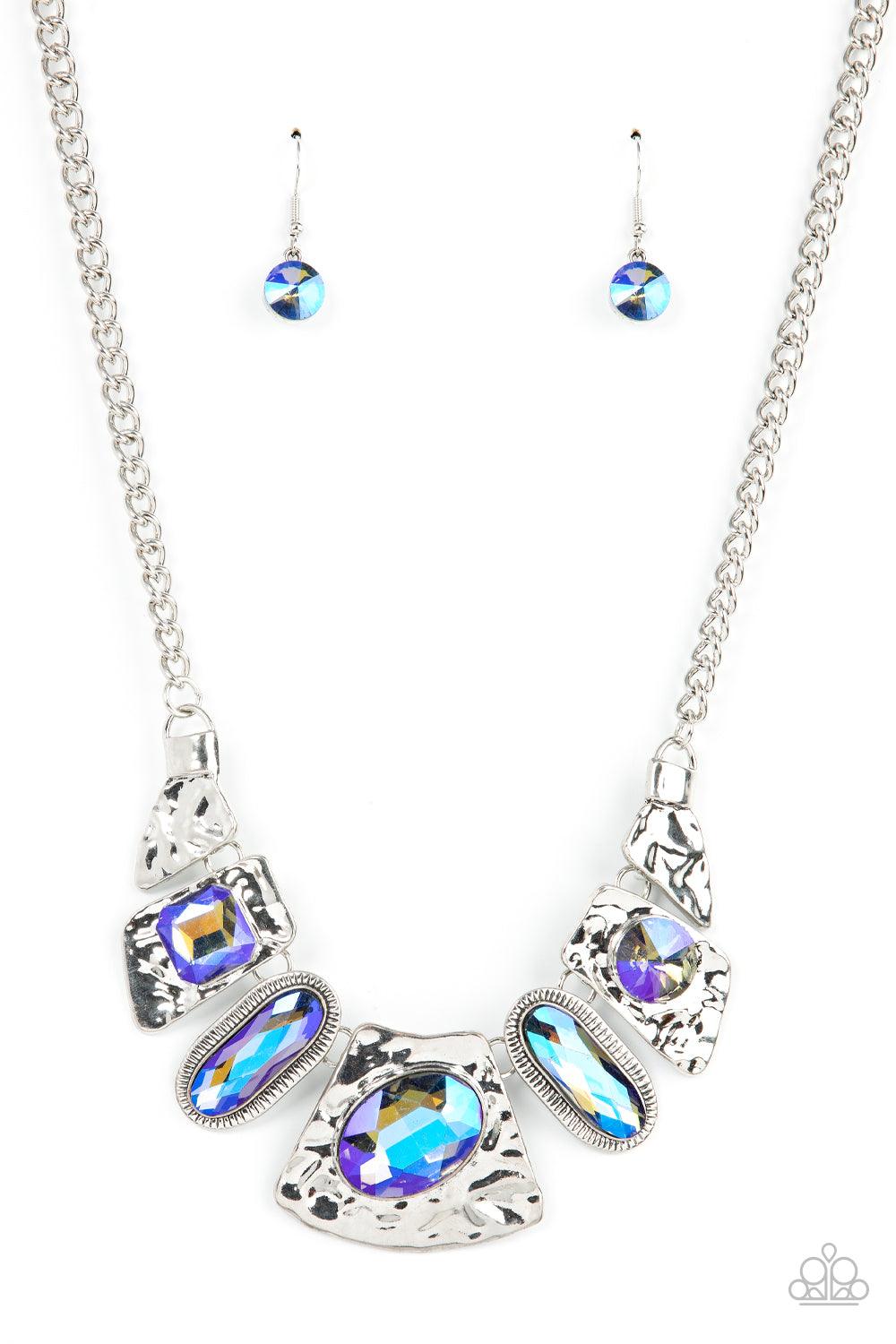 Paparazzi Accessories Futuristic Fashionista - Multi Featuring a stellar UV shimmer, mismatched iridescent multicolored gems adorn the front of hammered silver plates that abstractly connect below the collar for an out-of-this-world sparkle. Features an a