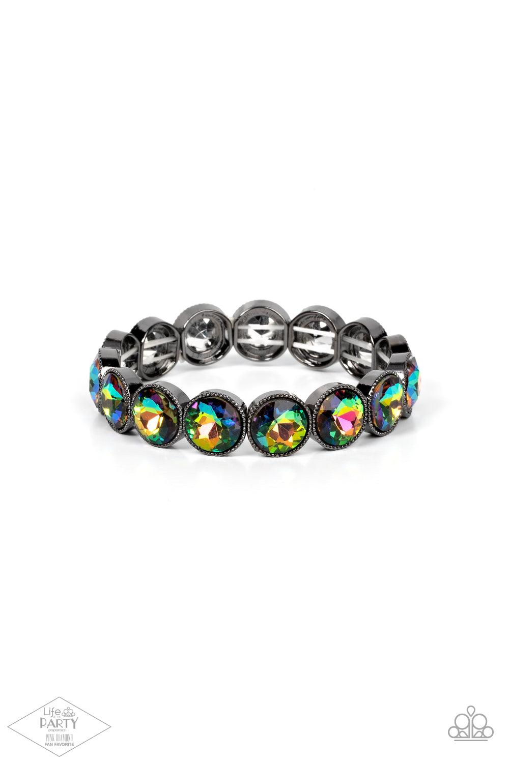 Paparazzi Accessories Number One Knockout - Multi Faceted oil spill gems are pressed into sleek gunmetal frames. The glittery frames are threaded along stretchy bands, creating a glamorous look around the wrist. Sold as one individual bracelet. Jewelry