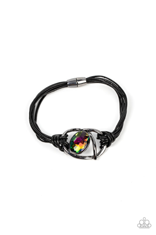 Paparazzi Accessories Keep Your Distance - Multi Shiny gunmetal bars abstractly twist around an oversized oval oil spill gem, resulting in a mesmerizing centerpiece that is knotted in place with layers of black leather cording. Features a magnetic closure