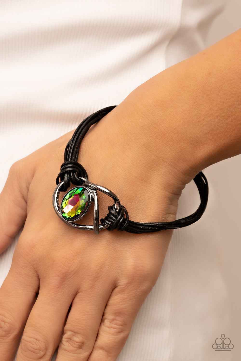 Paparazzi Accessories Keep Your Distance - Multi Shiny gunmetal bars abstractly twist around an oversized oval oil spill gem, resulting in a mesmerizing centerpiece that is knotted in place with layers of black leather cording. Features a magnetic closure