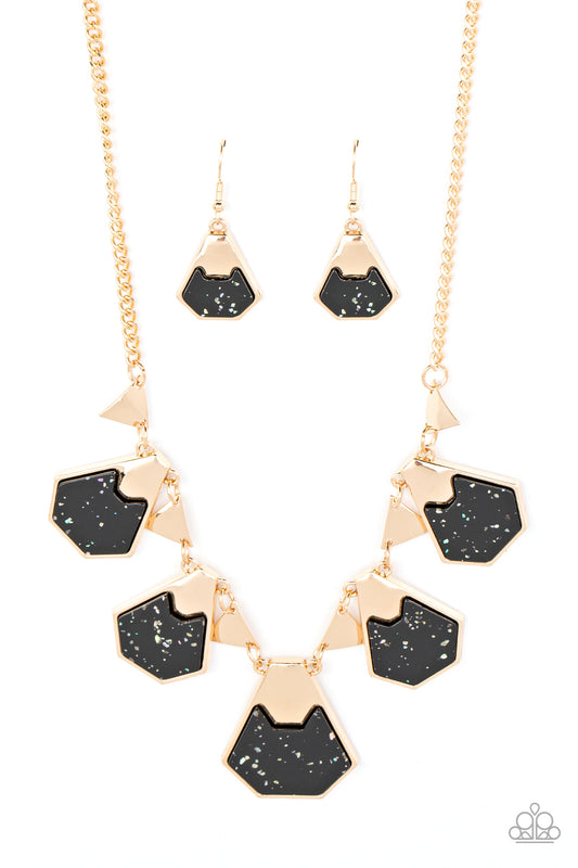 Paparazzi Accessories Extra Exclusive - Black Flecked in iridescent shell-like accents, geometric black acrylic frames are pinched in placed by folds of gold atop the front of flat gold frames. The glimmering frames alternate with dainty gold triangular f