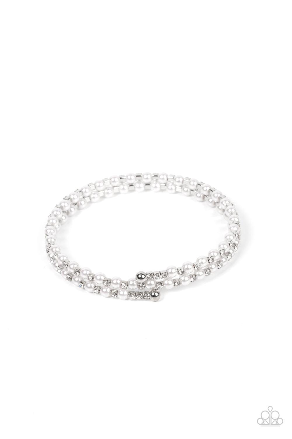 Paparazzi Accessories Regal Wraparound - White Dainty white pearls and white rhinestone dotted silver fittings alternate along an infinity wire around the wrist, resulting in wraparound shimmer. Sold as one individual bracelet. Jewelry