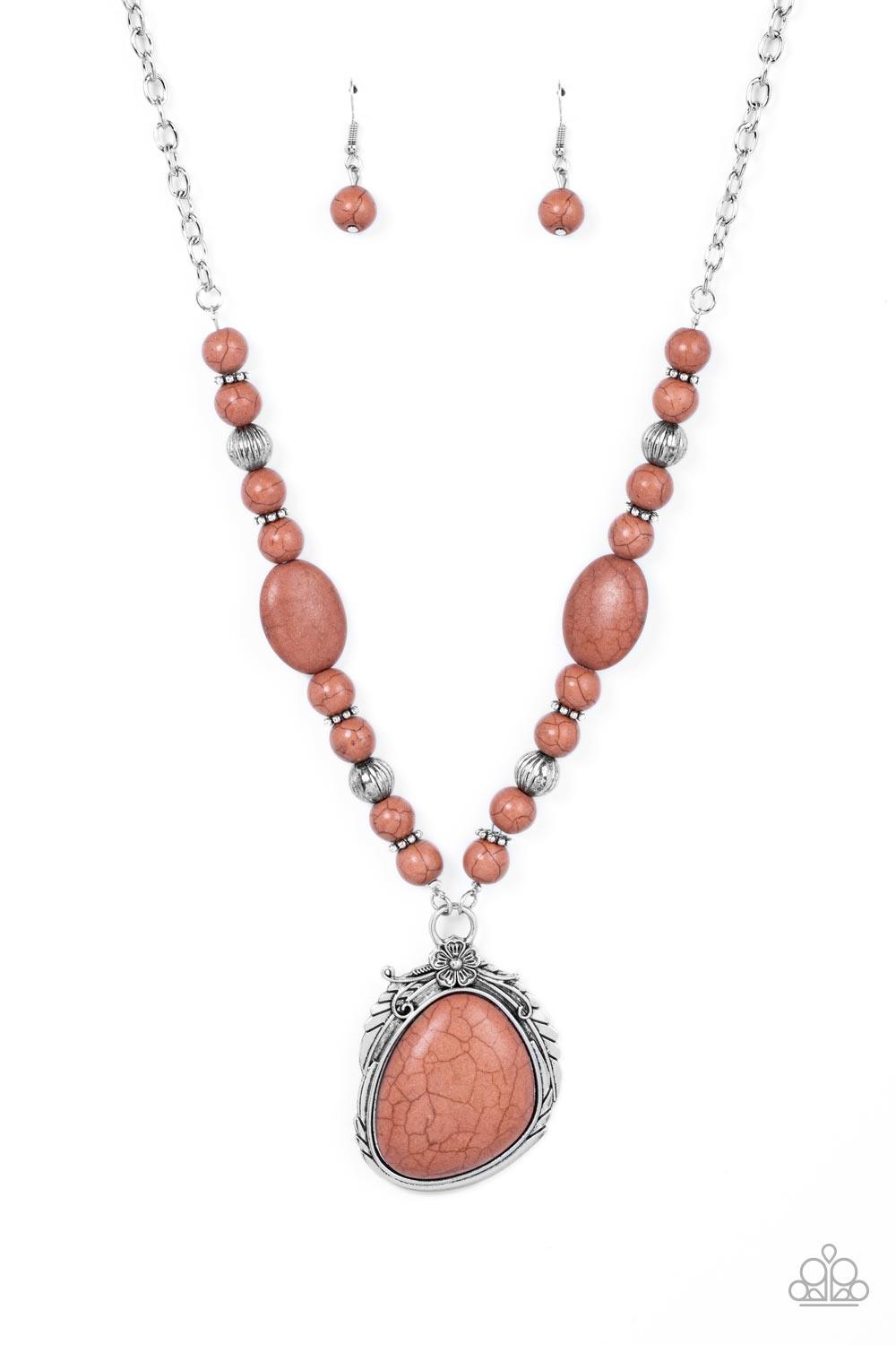 Paparazzi Accessories Southwest Paradise - Brown A lengthened silver chain flows into a succession of polished brown stone beads and silver accents. The flowy display gives way to an opulent brown stone that is pressed into an ornate silver frame. Adorned