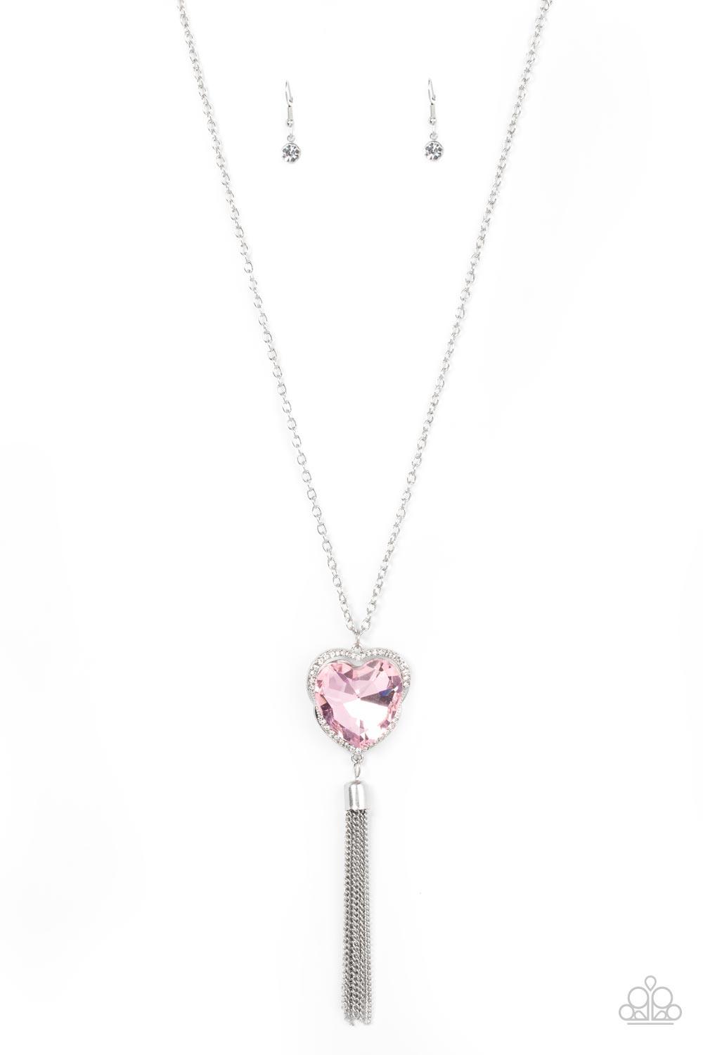 Paparazzi Accessories Finding My Forever - Pink Bordered in a ribbon of glassy white rhinestones, an oversized pink heart-shaped gem seemingly floats at the bottom of an extended silver chain. A shimmery silver chain tassel dances from the bottom of the s