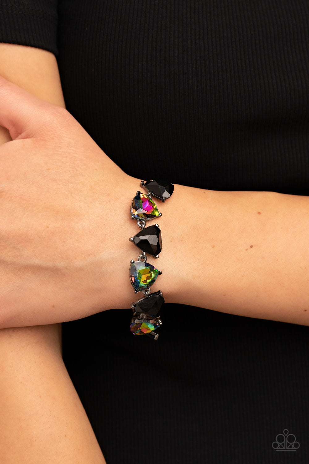 Paparazzi Accessories Pumped up Prisms - Multi Triangular cut black beads and oil spill gems alternate around the wrist, creating a prismatic pop of color. Features an adjustable clasp closure. Sold as one individual bracelet. Jewelry
