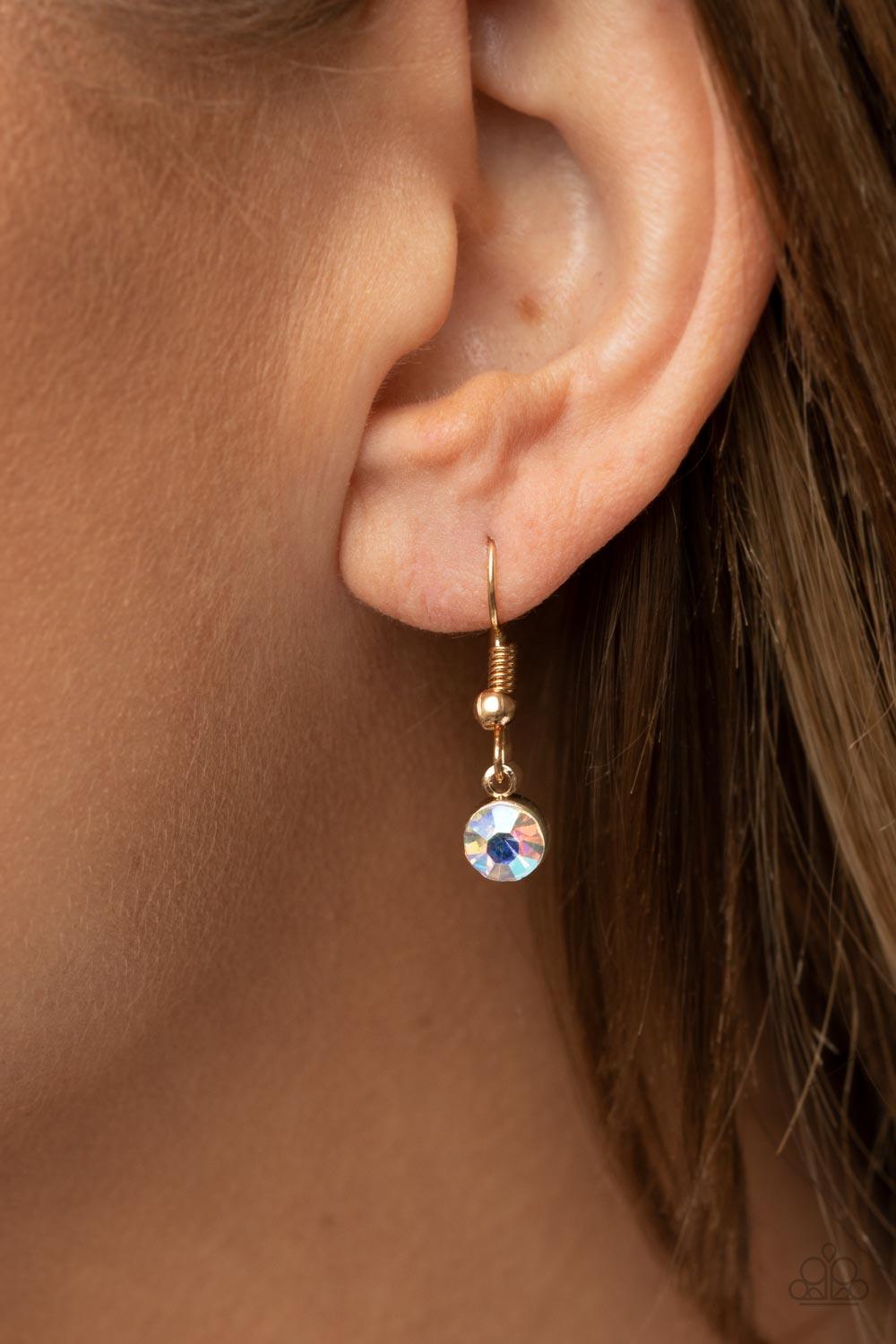 Paparazzi Accessories Lockdown My Heart - Gold An iridescent heart-shaped gem is pressed into a simple gold frame at the end of a gold box chain creating an adorable sentiment below the collar. Features an adjustable clasp closure. Sold as one individual