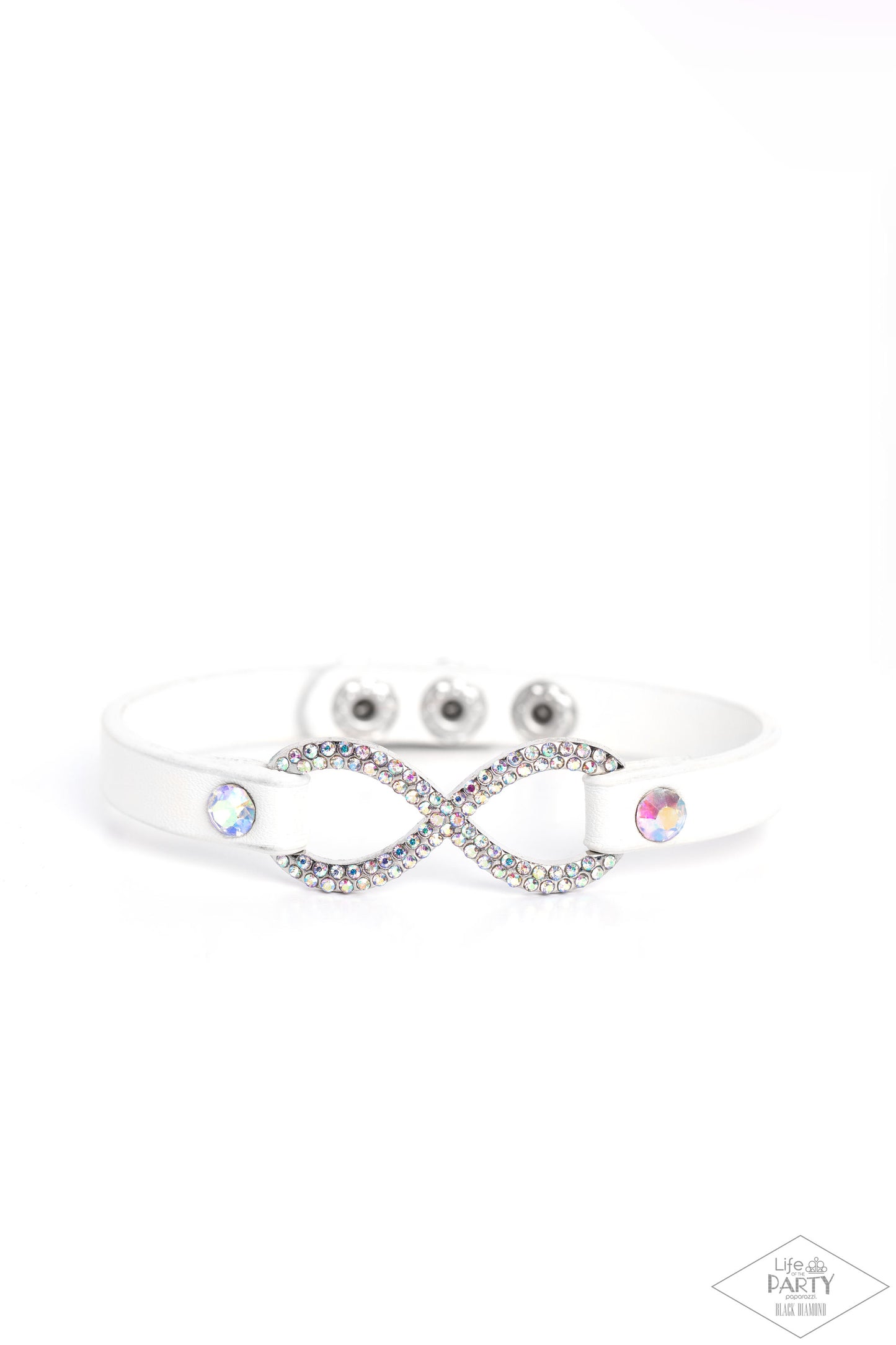 Paparazzi Accessories Innocent Till Proven GLITZY! - Multi A skinny strip of white leather attaches to a silver infinity symbol encrusted in glittery iridescent rhinestones. Flanked by two dazzling solitaire iridescent rhinestones, the glitzy design creat