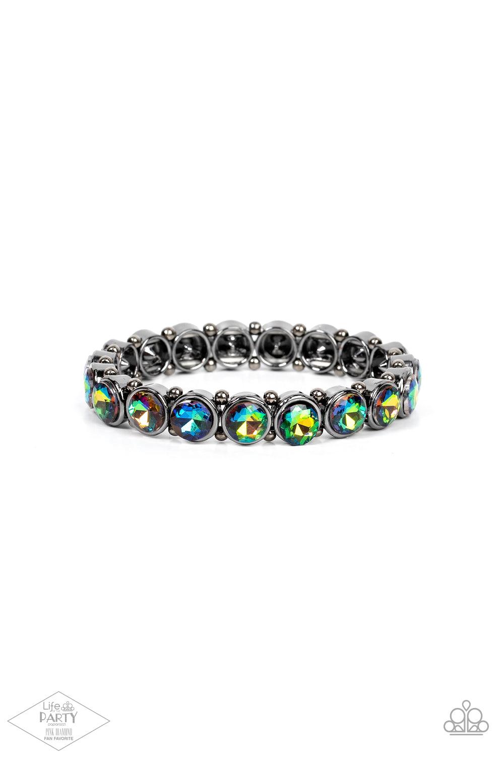 Paparazzi Accessories Sugar-Coated Sparkle - Multi 2 Infused with dainty gunmetal beads, glittery oil spill rhinestone encrusted frames are threaded along stretchy bands around the wrist for a glamorous look. Sold as one individual bracelet. Jewelry