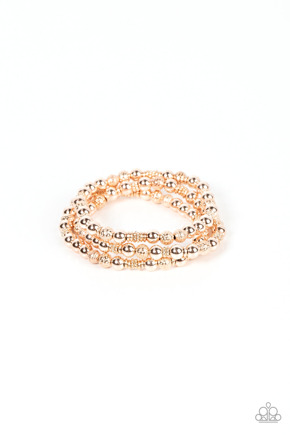 Paparazzi Accessories Boundless Boundaries - Rose Gold A shiny collection of smooth, studded, and textured rose gold beads are threaded along stretchy bands around the wrist, creating dainty layers. Sold as one set of three bracelets. Jewelry