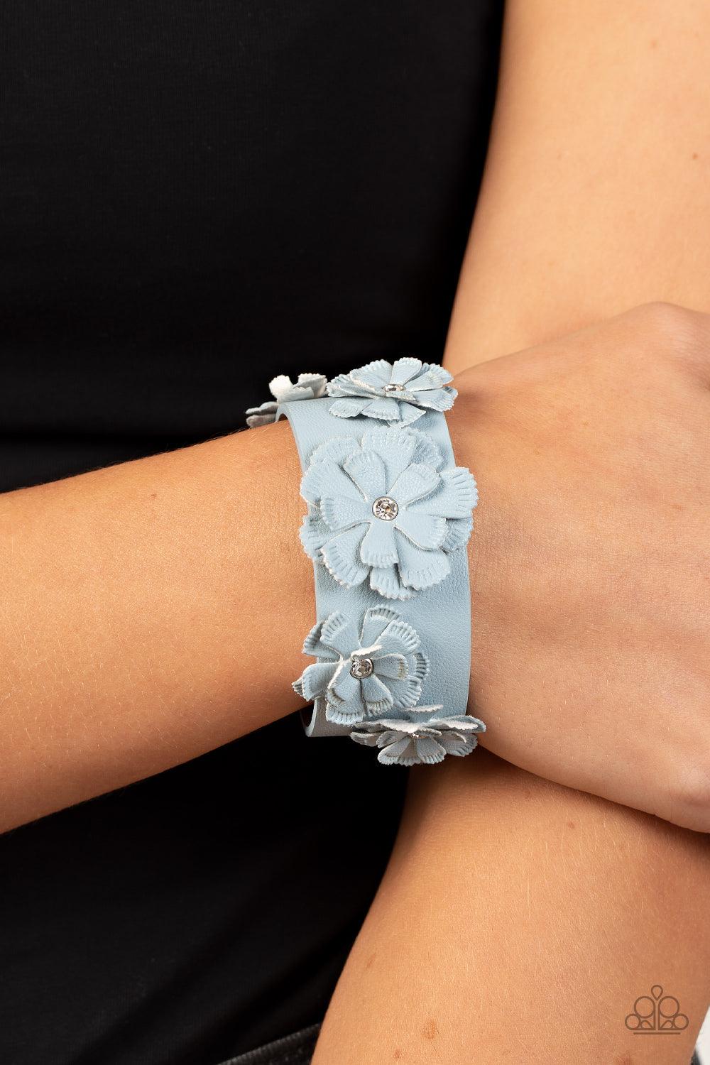 Paparazzi Accessories What Do You Pro-POSIES - Blue Dotted with dainty white rhinestone centers, textured Glacier Lake leather petals layer into a blooming floral centerpiece atop the front of a thick Glacier Lake leather band for a rustic finish. Feature