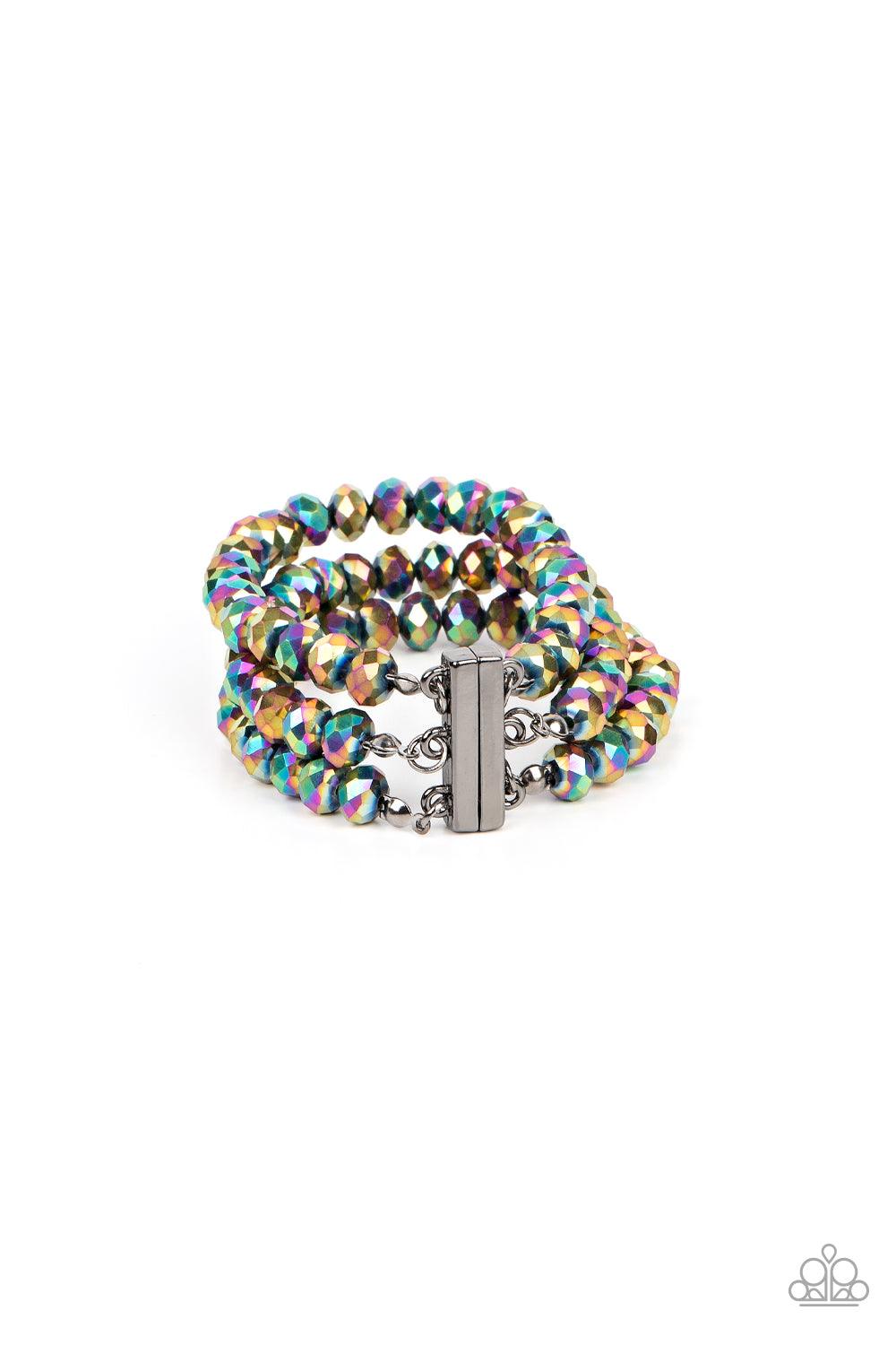 Paparazzi Accessories Supernova Sultry - Multi Rows of oil spill crystal-like beads are threaded along invisible wires around the wrist, layering into a smoldering sparkle. Features a magnetic closure. Sold as one individual bracelet. Jewelry