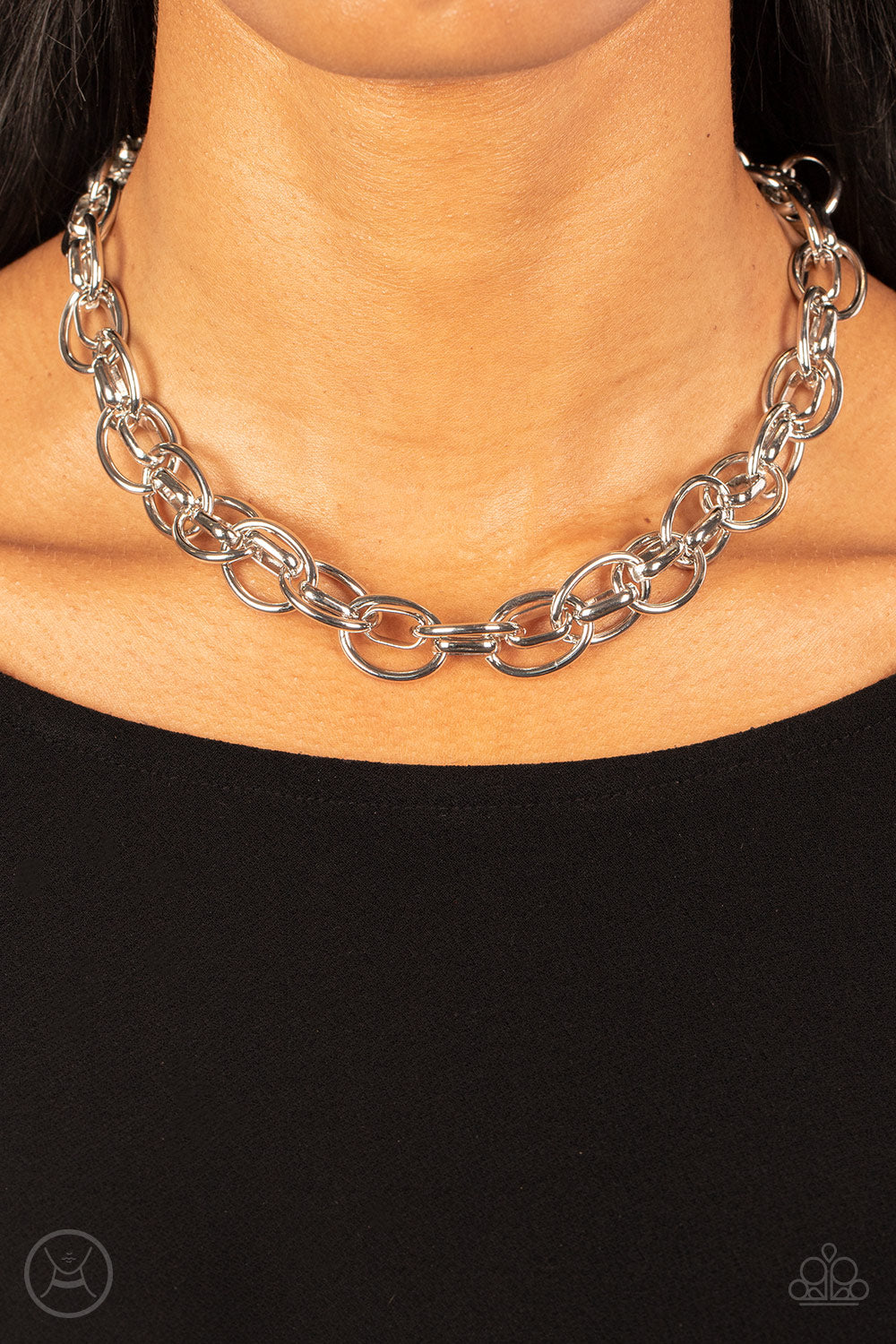 Paparazzi Accessories Tough Crowd - Silver An oversized silver chain interlocks with an oval linked chain, resulting in a rebellious fashion around the neck. Features an adjustable clasp closure. Sold as one individual choker necklace. Includes one pair o
