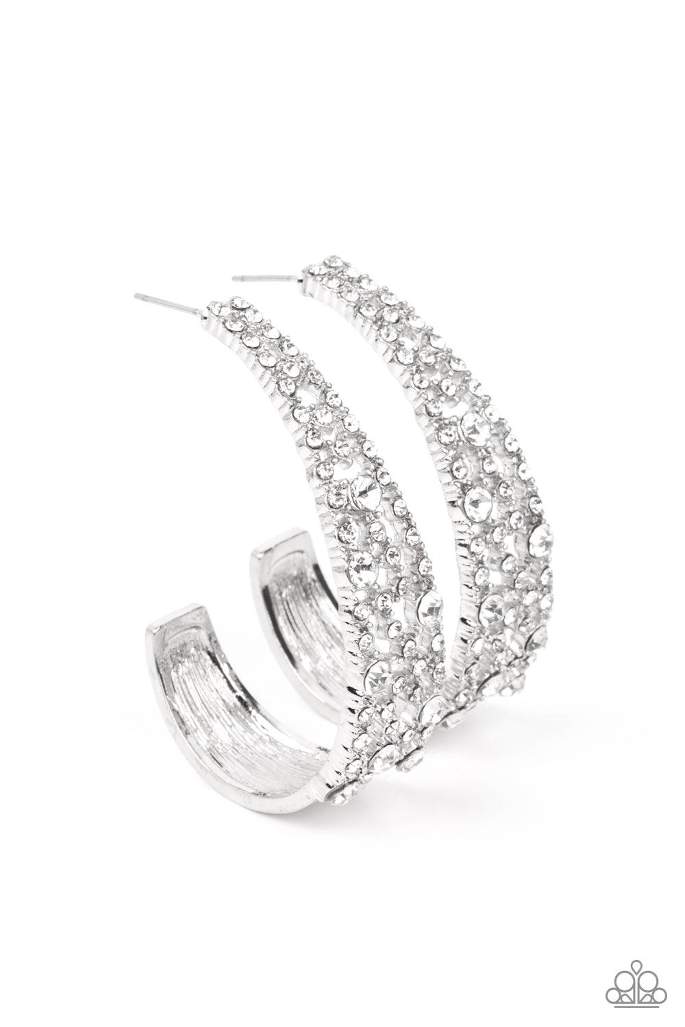 Paparazzi Accessories Cold as Ice - White Classic white rhinestones dot a silvery backdrop of dainty white rhinestones that delicately curves into a solid silver J-hoop, resulting in a jaw-dropping dazzle. Earring attaches to a standard post fitting. Hoop