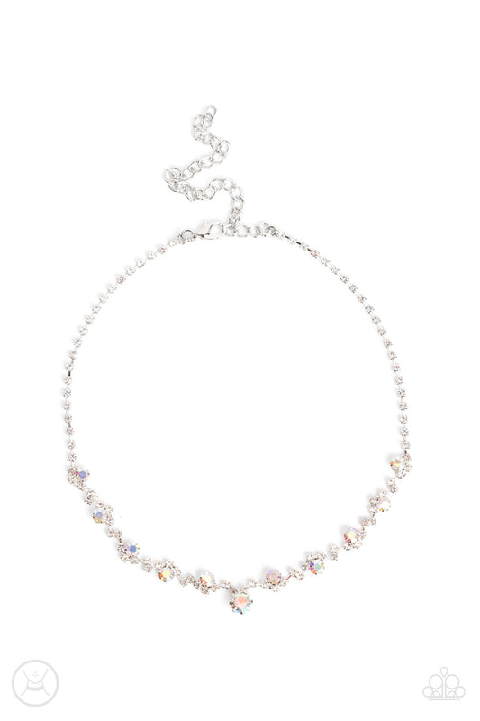 Paparazzi Accessories Regal Rebel - Multi Featuring pronged silver fittings, pairs and clusters of dainty white and iridescent rhinestones delicately connect to a strand of icy white rhinestones around the neck for a regal attitude. Features an adjustable