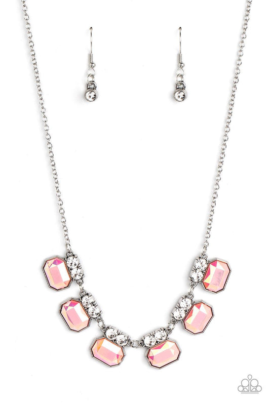 Paparazzi Accessories Interstellar Inspiration - Pink Featuring an iridescent UV finish, glitzy pink rhinestones are crowned in pairs of glassy white rhinestones as they delicately link below the collar for an out-of-this-world sparkle. Features an adjust