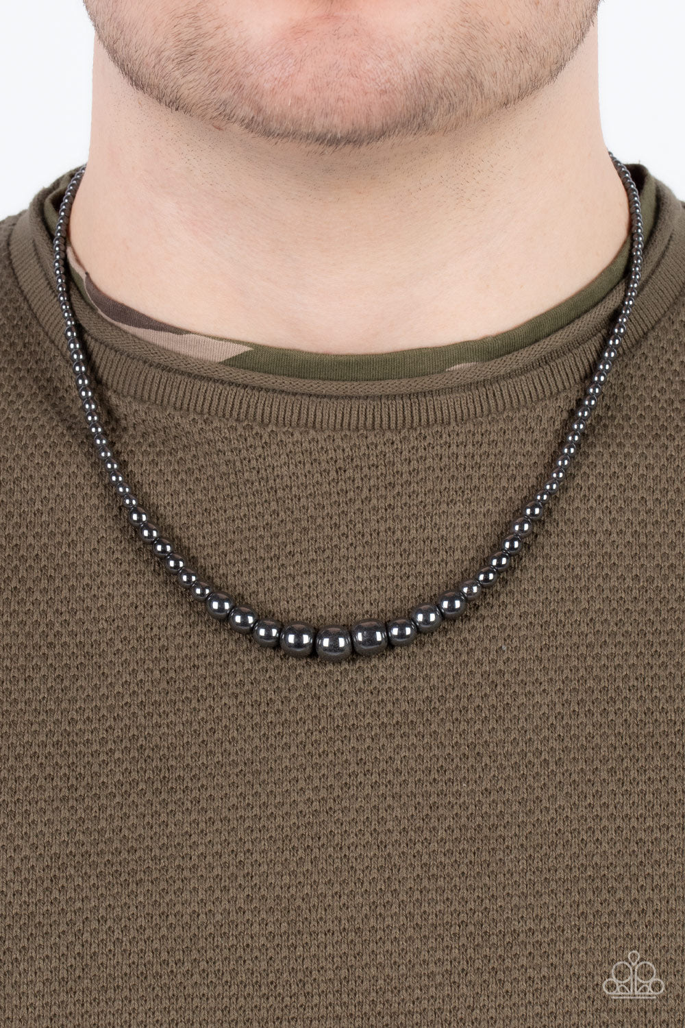 Paparazzi Accessories Beg, Borrow, or STEEL - Black Gradually increasing in size, glistening gunmetal beads are threaded along an invisible wire below the collar for an intense industrial edge. Features an adjustable clasp closure. Sold as one individual