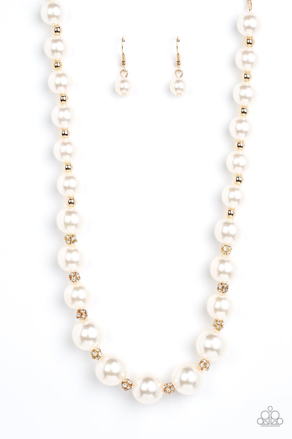 Paparazzi Accessories Sail Away with Me - Gold Gradually increasing in size, bubbly white pearls alternate with glistening gold beads and white rhinestone encrusted accents below the collar for a timeless finish. Features an adjustable clasp closure. Sold