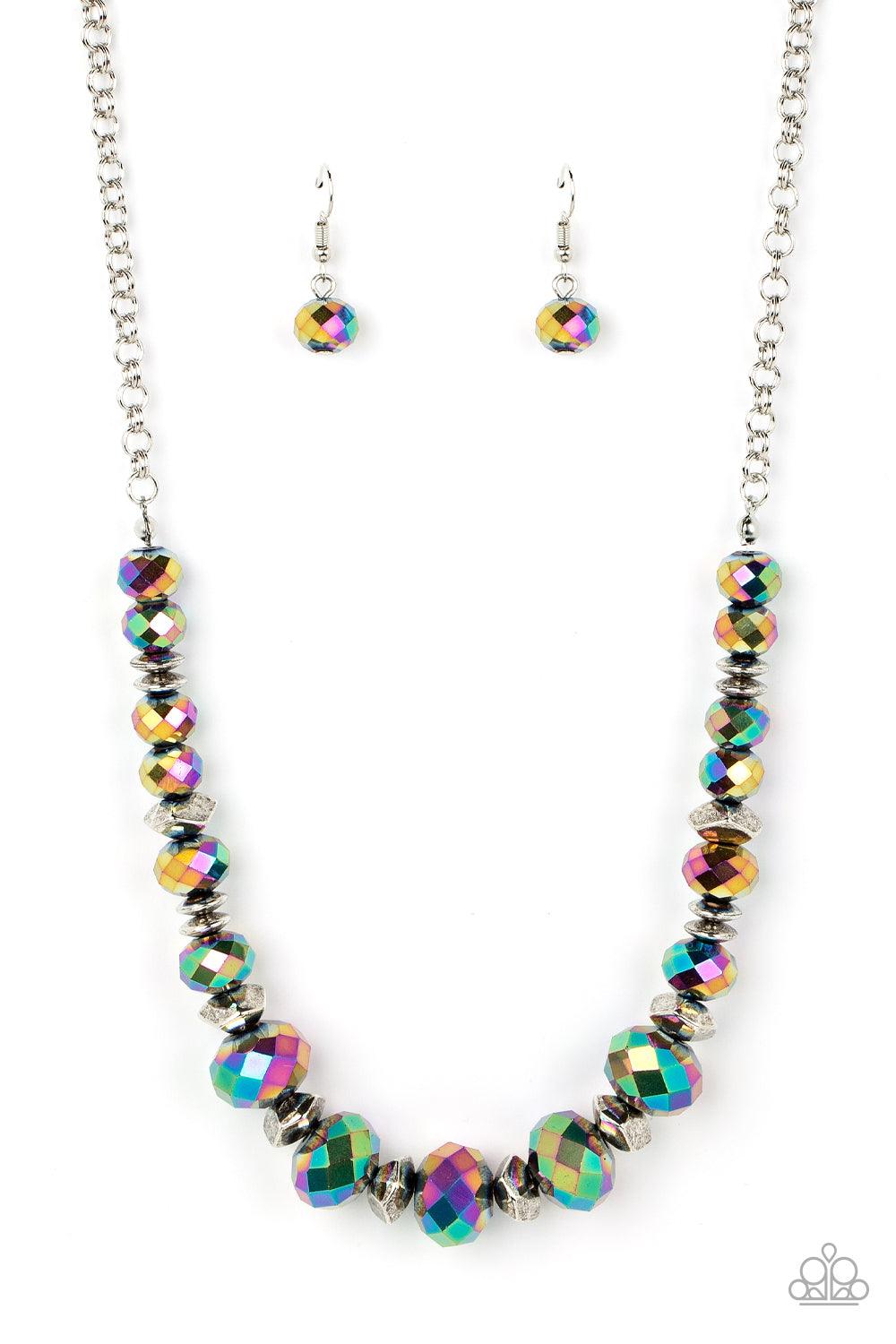 Paparazzi Accessories Cosmic Cadence - Multi Separated by silver discs and faceted silver accents, faceted oil spill crystal-like gems are threaded along an invisible wire below the collar for a stellar statement. Due to its prismatic palette, color may v