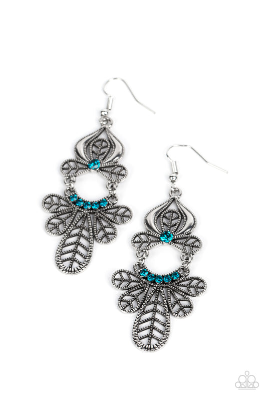 Paparazzi Accessories Galapagos Gala - Blue Studded leafy frames flare out from the bottom of a curved row of glittery blue rhinestones that swings from the bottom of a matching leafy silver frame. A solitaire blue rhinestone dots the uppermost frame, add