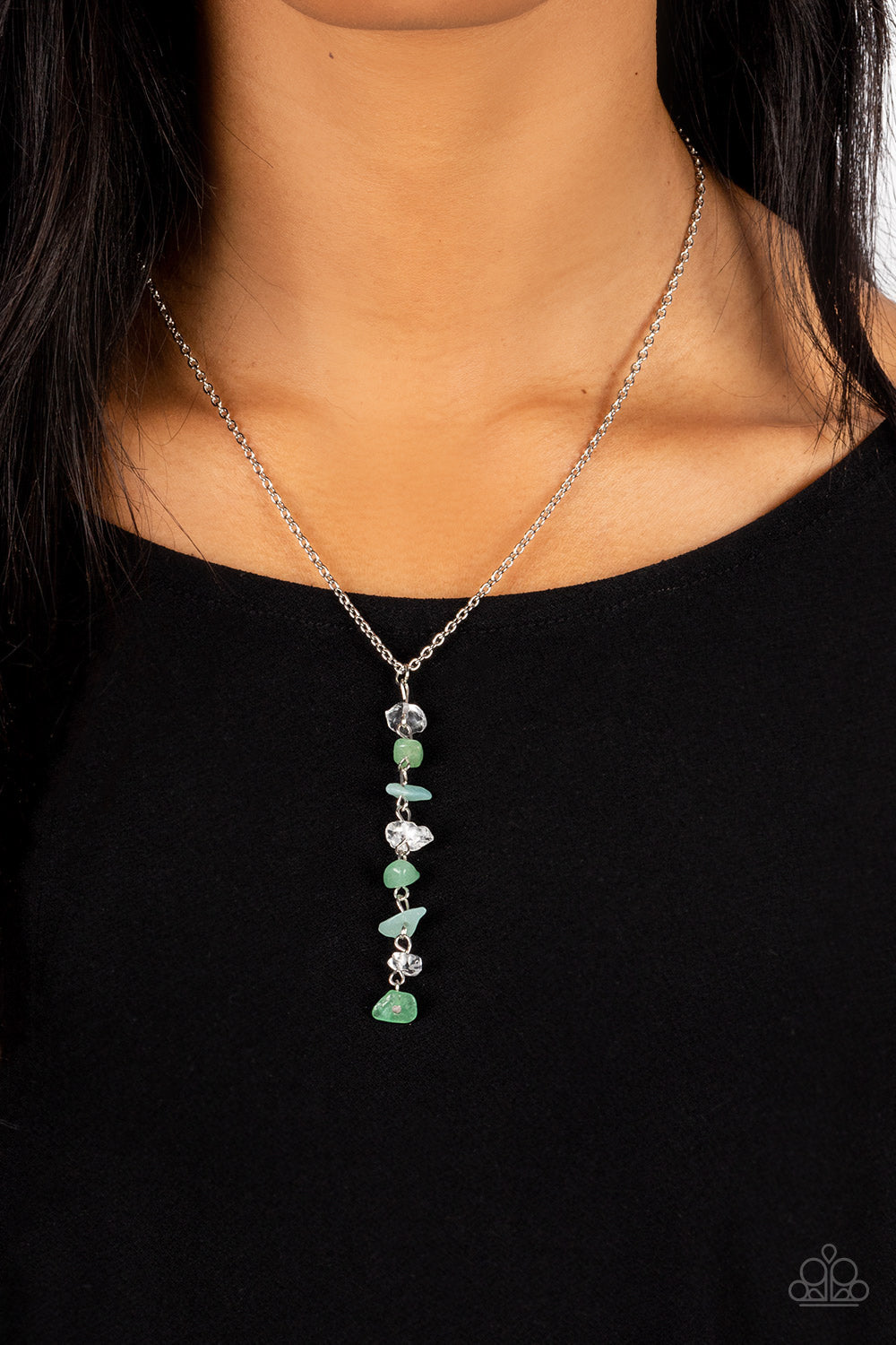 Paparazzi Accessories Tranquil Tidings - Green A dainty stack of quartz, jade, and aventurine pebbles trickles from the bottom of a classic silver chain, creating a tranquil extended pendant down the chest. Features an adjustable clasp closure. As the sto
