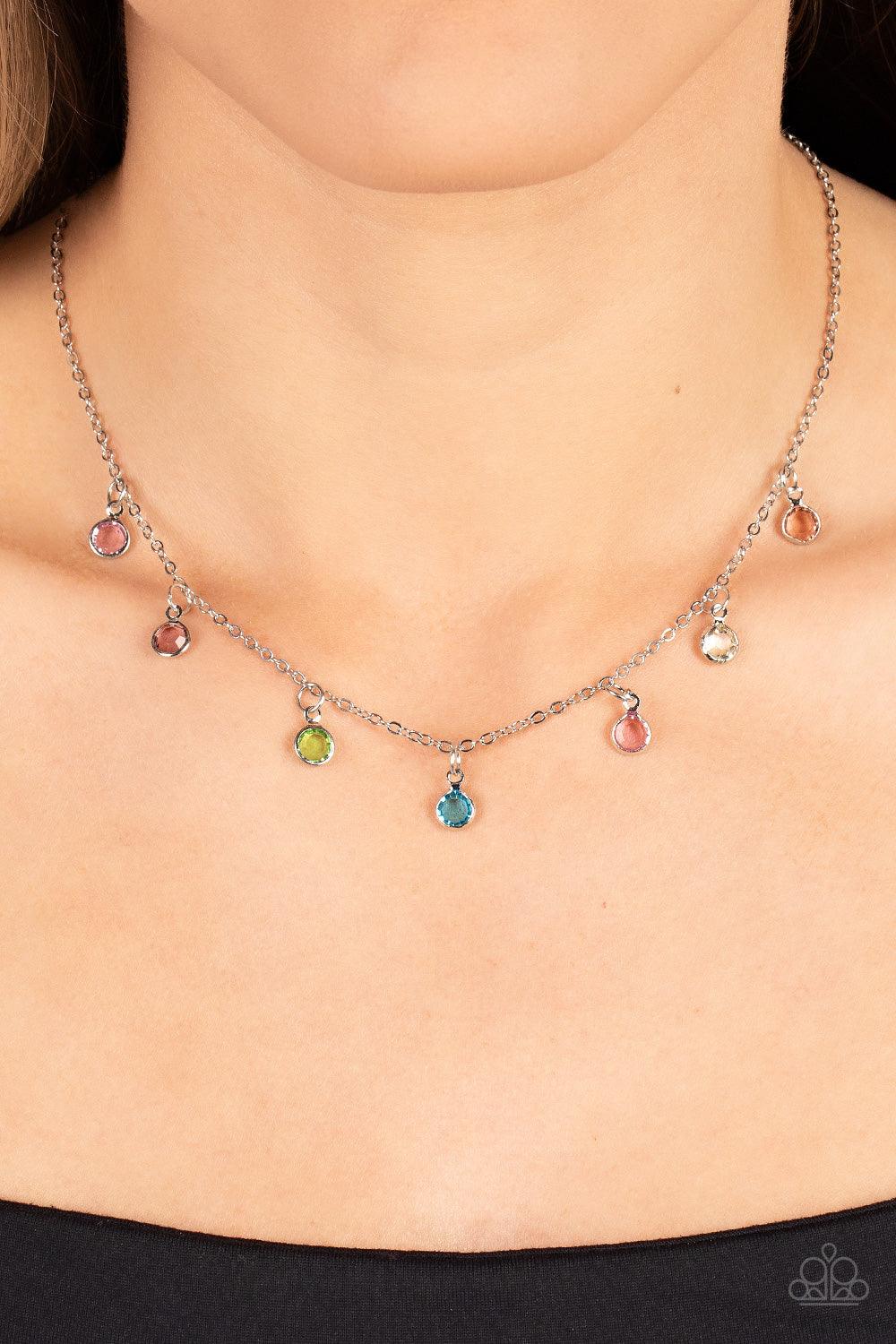 Paparazzi Accessories Carefree Charmer - Multi Encased in sleek silver fittings, a dainty collection of glassy multicolored gems twinkles along a dainty silver chain below the collar, creating a colorful fringe. Features an adjustable clasp closure. Sold
