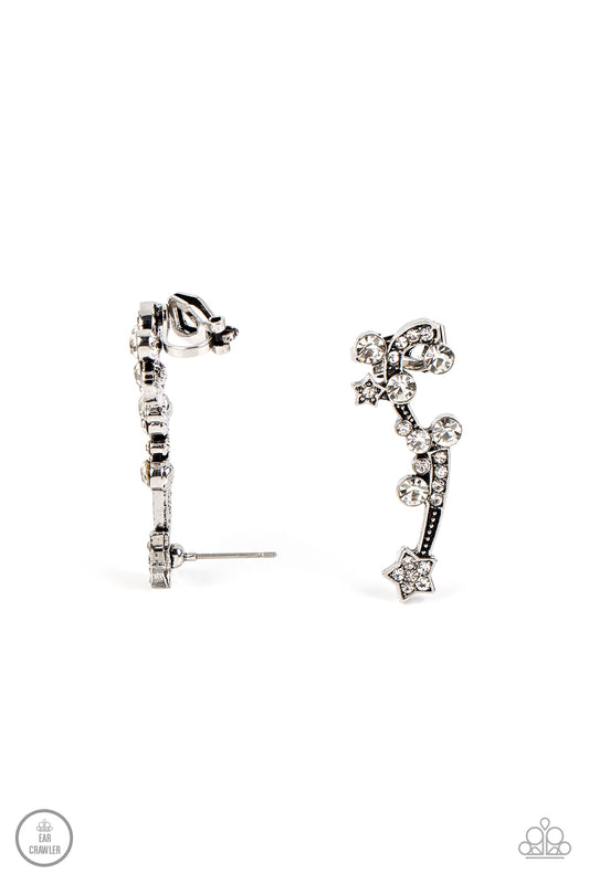 Paparazzi Accessories Astral Anthem - White Dotted with dainty silver studs, glittery white rhinestones, a white rhinestone dotted star, and a glittery ribbon streams out from a white rhinestone dotted silver star like a shooting star as it climbs the ear