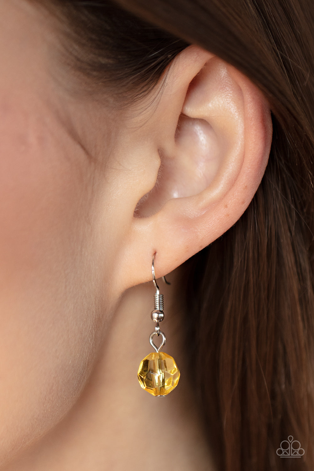 Paparazzi Accessories Tropical Hideaway - Yellow Separated by dainty silver rings, mismatched rows of glassy, opaque, and solid Daffodil acrylic crystal-like beads are threaded along invisible wires below the collar, creating vivacious layers. Features an