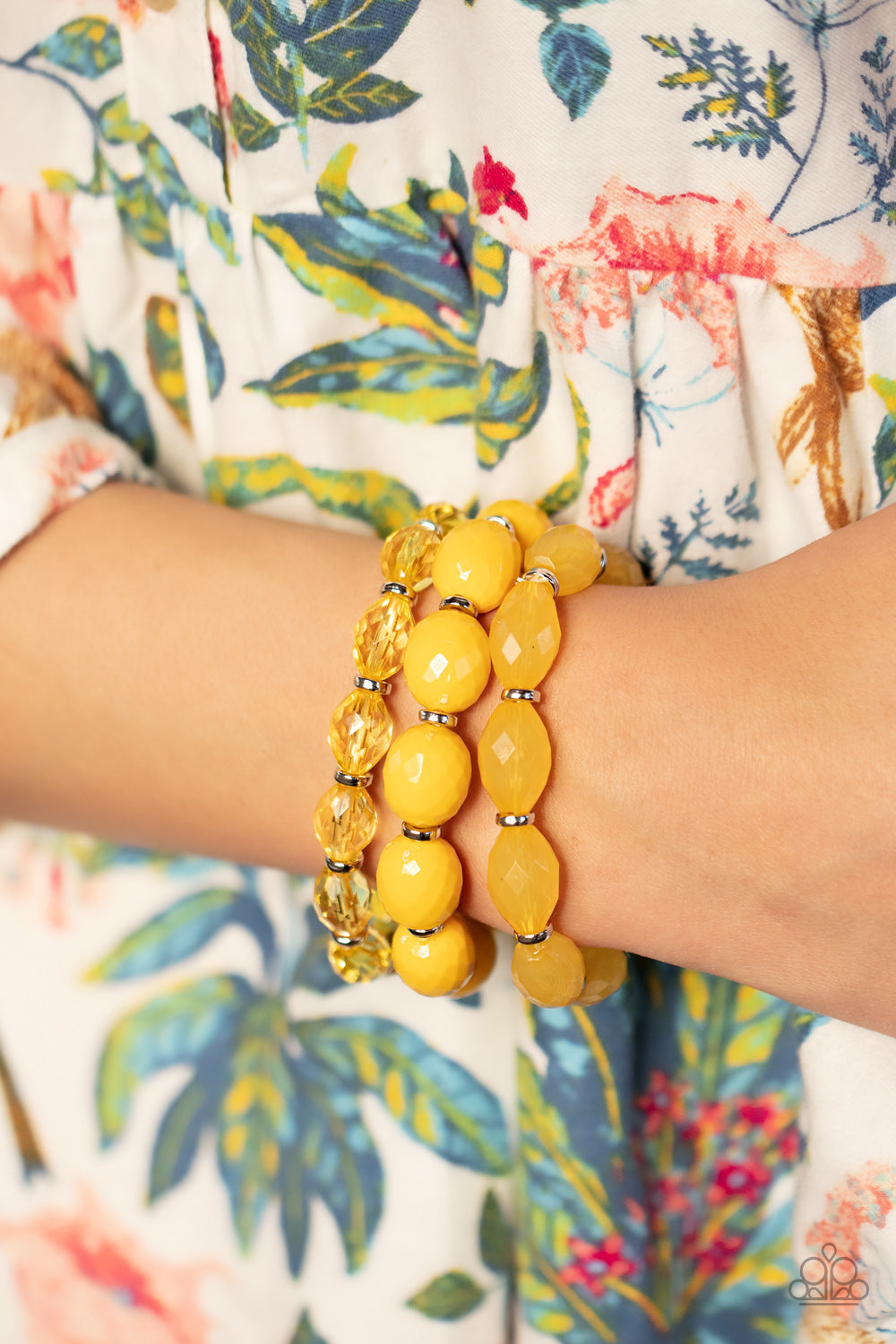 Paparazzi Accessories High Tide Hammock - Yellow Separated by dainty silver rings, mismatched rows of glassy, opaque, and solid Daffodil acrylic crystal-like beads are threaded along stretchy bands around the wrist, creating vivacious layers. Sold as one