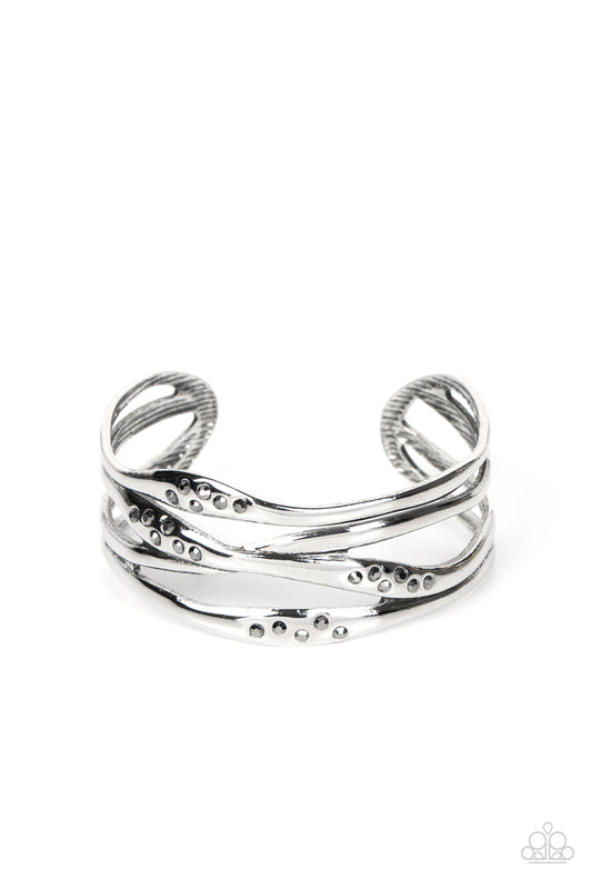 Paparazzi Accessories Line It Up - Silver Dusted in sections of dainty hematite rhinestones, asymmetrical silver bars boldly crisscross the wrist into a gritty yet glamorous cuff. Sold as one individual bracelet. Jewelry