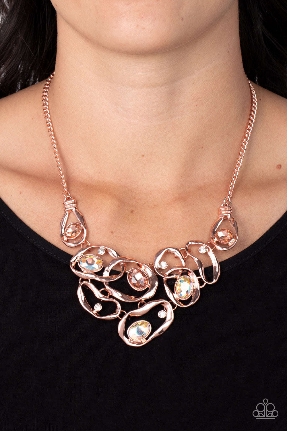 Paparazzi Accessories Warp Speed - Copper Warped shiny copper frames asymmetrically curl around dainty white rhinestones and peach and iridescent gem accents, interlocking into a contemporary statement piece below the collar. Features an adjustable clasp