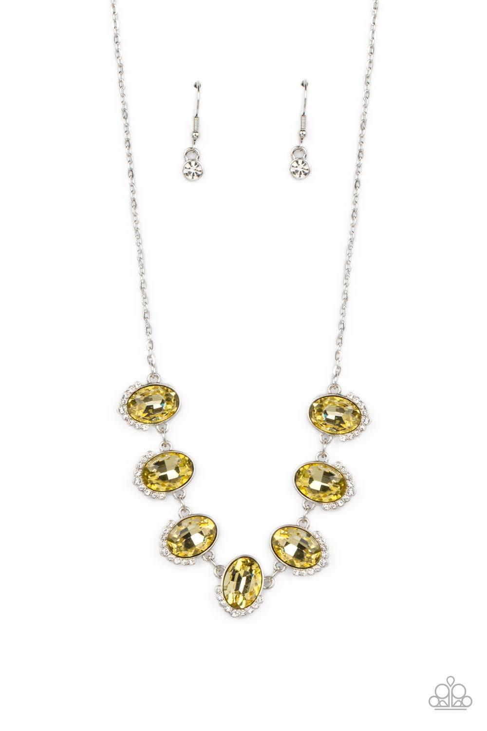 Paparazzi Accessories Unleash Your Sparkle - Yellow Dainty rows of glittery white rhinestones gently curve around the bottoms of oversized Daffodil oval gems. The sparkly frames delicately connect below the collar, creating a colorful centerpiece. Feature