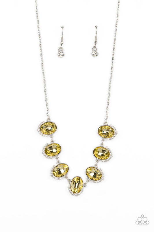 Paparazzi Accessories Unleash Your Sparkle - Yellow Dainty rows of glittery white rhinestones gently curve around the bottoms of oversized Daffodil oval gems. The sparkly frames delicately connect below the collar, creating a colorful centerpiece. Feature