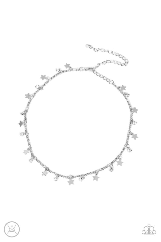 Paparazzi Accessories Little Lady Liberty - White Dainty white rhinestones and flat silver stars twinkle along a classic silver chain around the neck, resulting in a stellar fringe. Features an adjustable clasp closure. Sold as one individual choker neckl