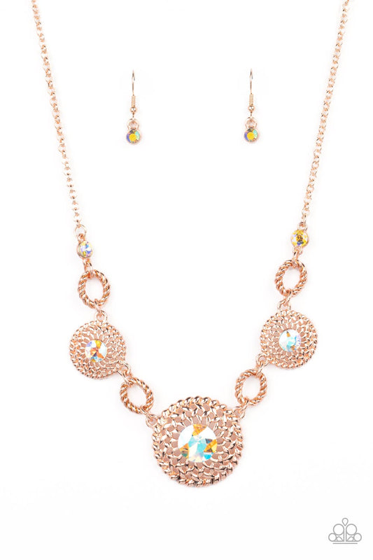Paparazzi Accessories Cosmic Cosmos - Multi Airy rose gold petals delicately bloom inside twisted rose gold hoops below the collar. Dotted with iridescent rhinestone centers, the flowery frames gradually increase in size as they link with twisted rose gol