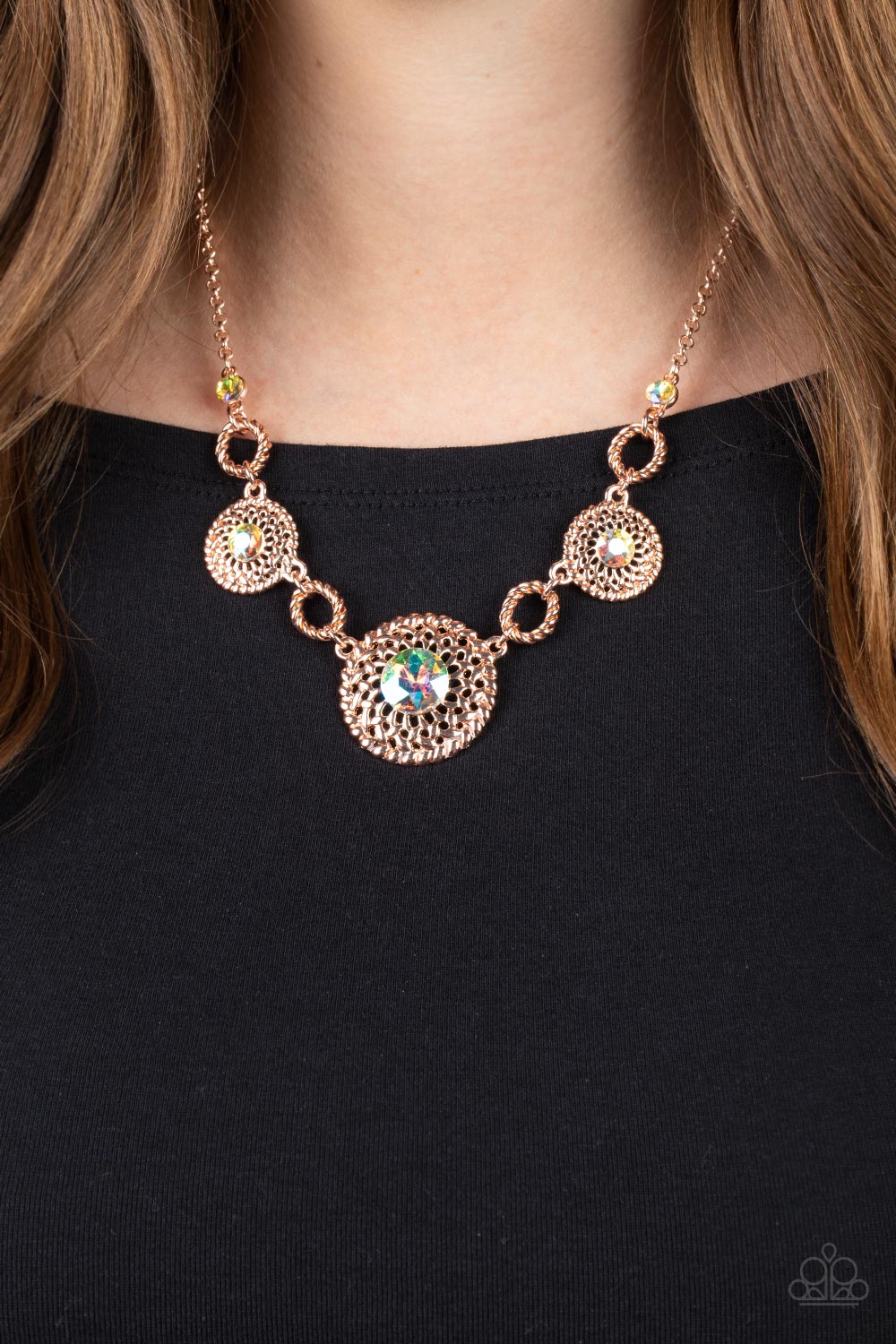 Paparazzi Accessories Cosmic Cosmos - Multi Airy rose gold petals delicately bloom inside twisted rose gold hoops below the collar. Dotted with iridescent rhinestone centers, the flowery frames gradually increase in size as they link with twisted rose gol