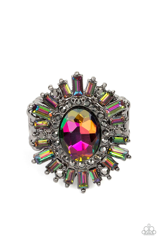 Paparazzi Accessories Astral Attitude - Multi A large oil spill rhinestone sparkles inside a ring of dainty hematite rhinestones. Emerald cut oil spill and hematite rhinestones fan out from the dazzling center, exploding into a stellar centerpiece atop th
