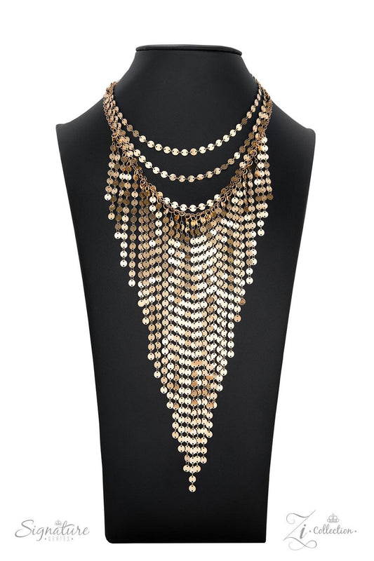 Paparazzi Accessories The Suz A seemingly infinite collection of dainty gold discs flickers and flashes as they catch the light, draping into four shimmery rows down the chest. Twinkly tassels of matching gold discs stream out from the bottom of the lower