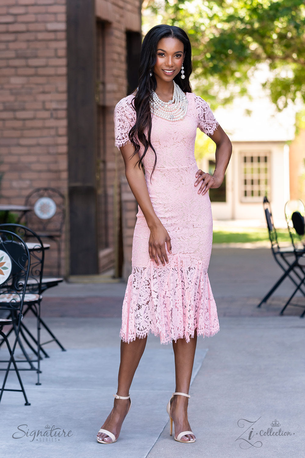 Paparazzi Accessories The Courtney Strand after strand of lustrous white pearls layer down the chest, creating timeless tiers. Airy silver spheres, adorned in sparkling white rhinestones, are effortlessly sprinkled among the sea of pearls, infusing the de