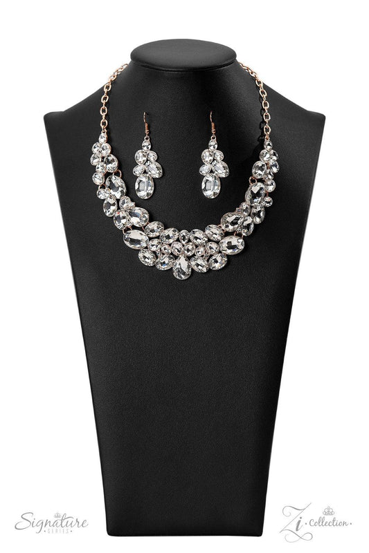 Paparazzi Accessories The Jenni Oversized white rhinestones with exaggerated faceted surfaces gather into glittery clusters along the collar. A teardrop-shaped gem sits front-and-center, inviting the eye to explore the scattered shapes throughout the desi