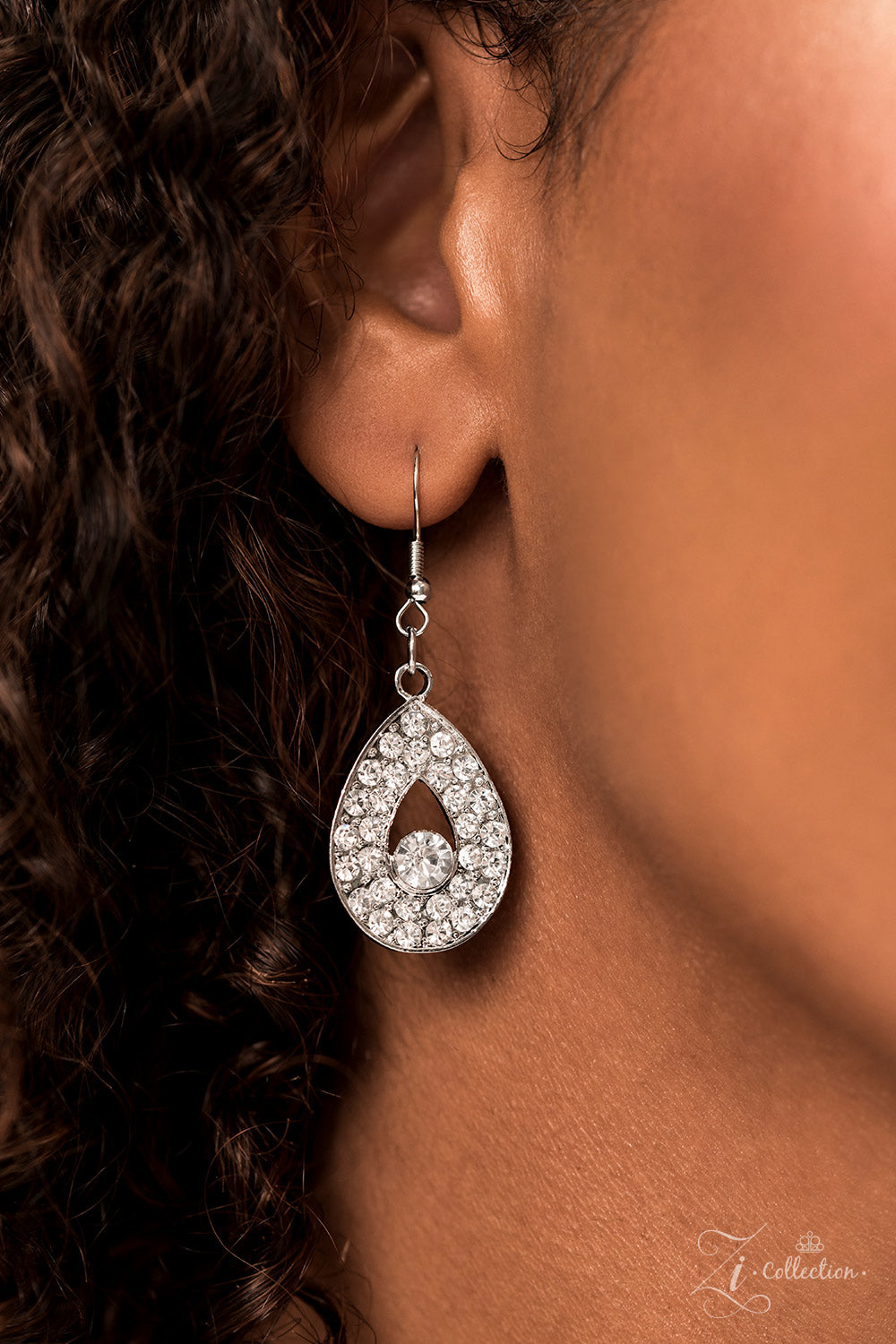 Paparazzi Accessories Exquisite Silver, teardrop-shaped frames are stacked on-point below airy marquise cutouts, creating a subtle figure-eight. The hourglass shapes are threaded along invisible wires, falling into place alongside diamond-shaped frames, c