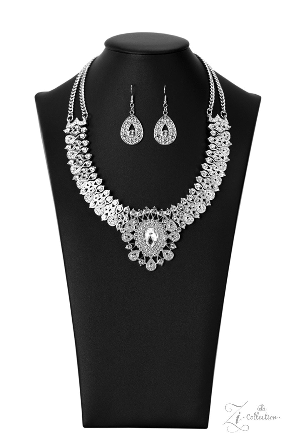 Paparazzi Accessories Exquisite Silver, teardrop-shaped frames are stacked on-point below airy marquise cutouts, creating a subtle figure-eight. The hourglass shapes are threaded along invisible wires, falling into place alongside diamond-shaped frames, c