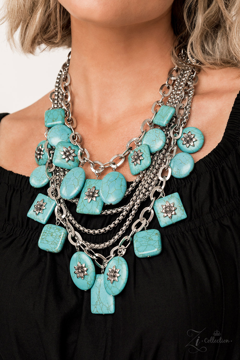 Paparazzi Accessories Bountiful Strands of oversized silver chain links and rounded box chain in the same metallic sheen, drape into dramatic layers across the chest, creating a boisterous collision of texture. Smooth turquoise stones, chiseled into large