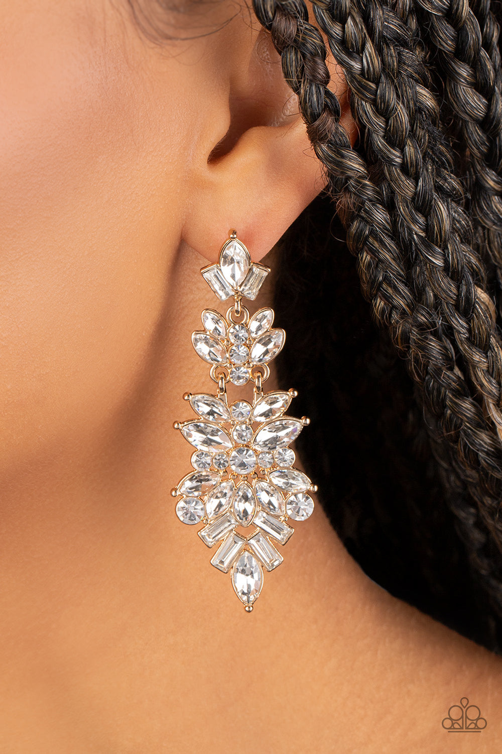 Paparazzi Accessories Frozen Fairytale - Gold Trestles of round, marquise, and emerald cut rhinestones cluster into three sparkly segments as they link into a jaw-dropping lure, resulting in an icy statement piece. Earring attaches to a standard post fitt