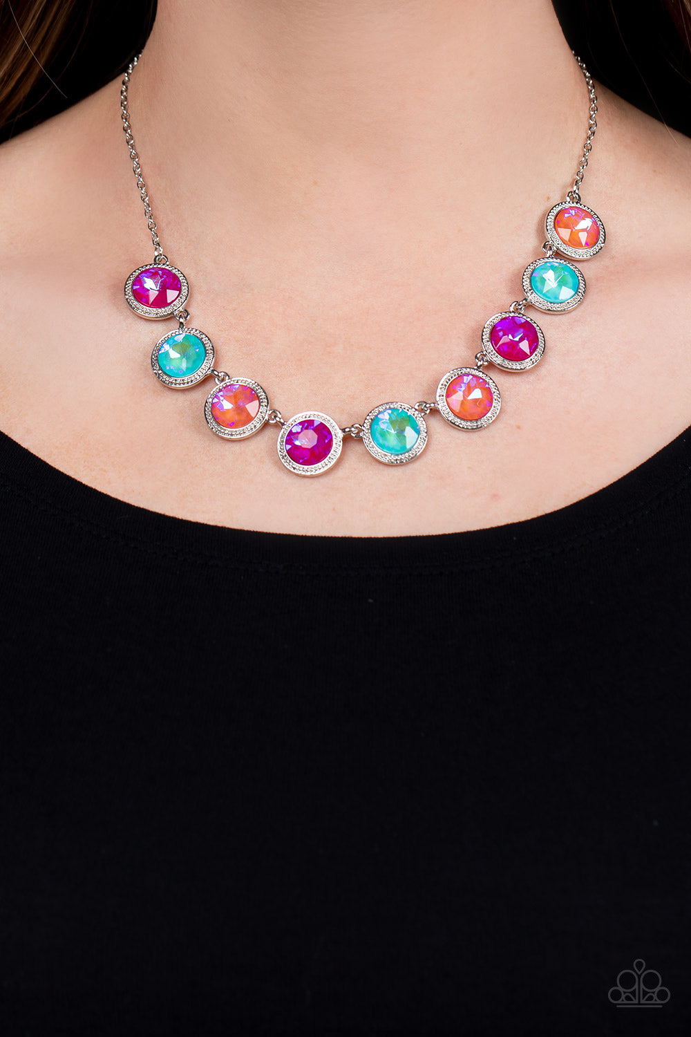 Paparazzi Accessories Queen of the Cosmos - Orange Featuring stellar iridescent finishes, a glittery collection of coral, blue, and pink gems sparkles inside studded silver frames. The colorful frames delicately link below the collar, creating an out-of-t