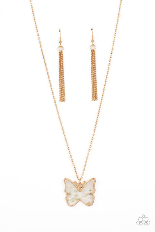 Paparazzi Accessories Gives Me Butterflies - Gold Dainty flecks of shell are encased in a glassy casing inside of a gold butterfly frame at the bottom of a shiny gold chain, creating a whimsical pendant. Features an adjustable clasp closure. Sold as one i