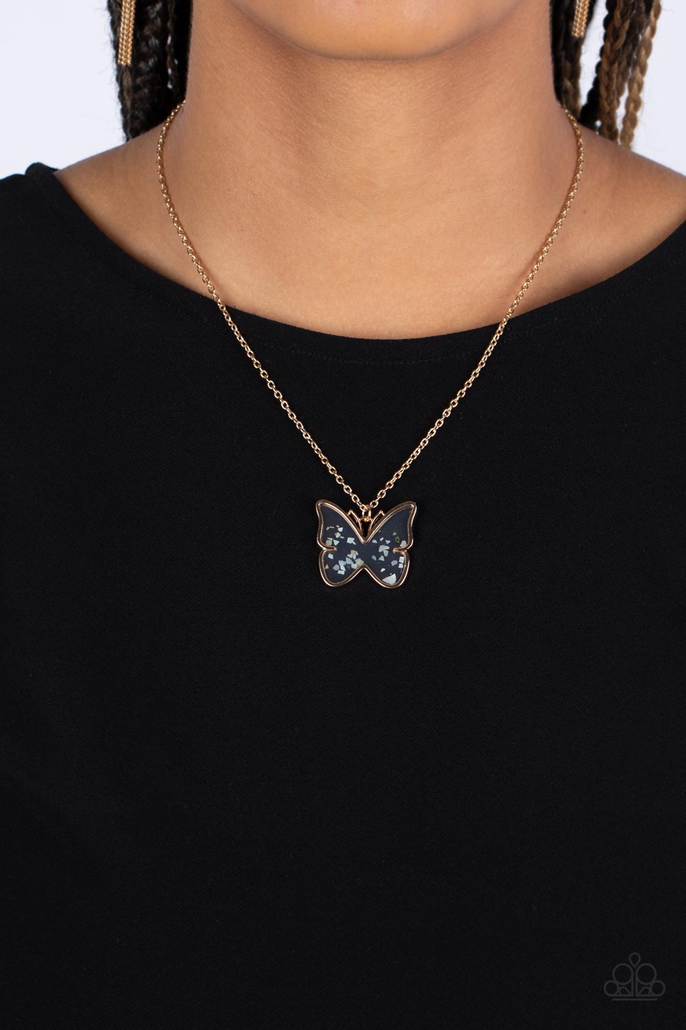 Paparazzi Accessories Gives Me Butterflies - Gold Dainty flecks of shell are encased in a glassy casing inside of a gold butterfly frame at the bottom of a shiny gold chain, creating a whimsical pendant. Features an adjustable clasp closure. Sold as one i