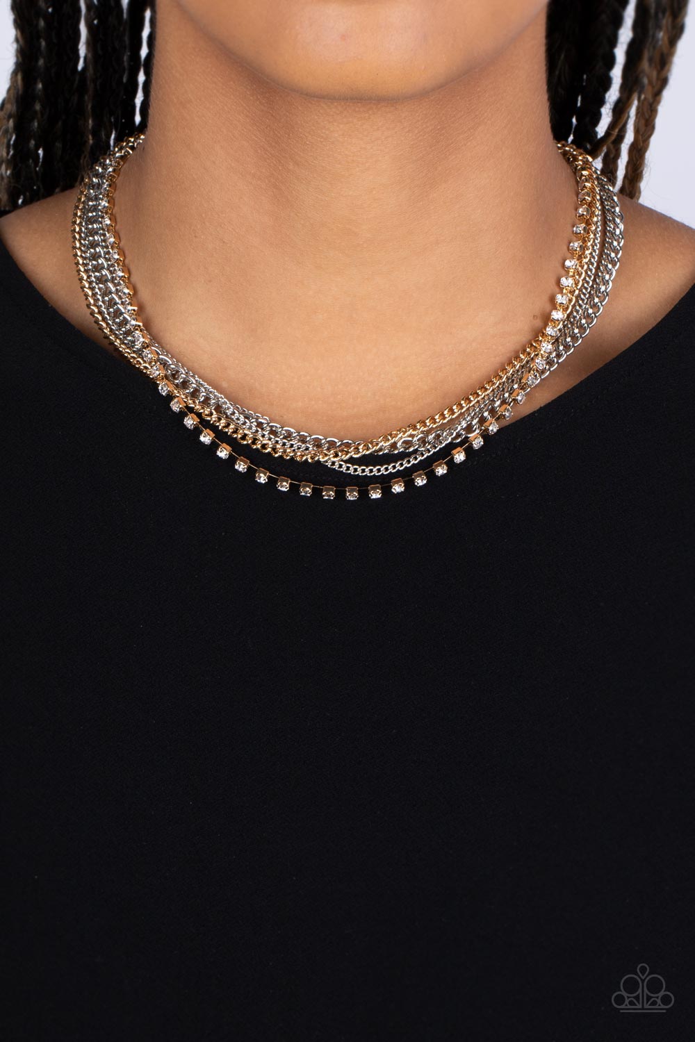 Paparazzi Accessories Free to CHAINge My Mind - Multi A mashup of gold and silver chains collides with a strand of sparkling white rhinestones encased in gold fittings. The contrast of gritty gold and silver finishes and shimmery accents creates a brillia